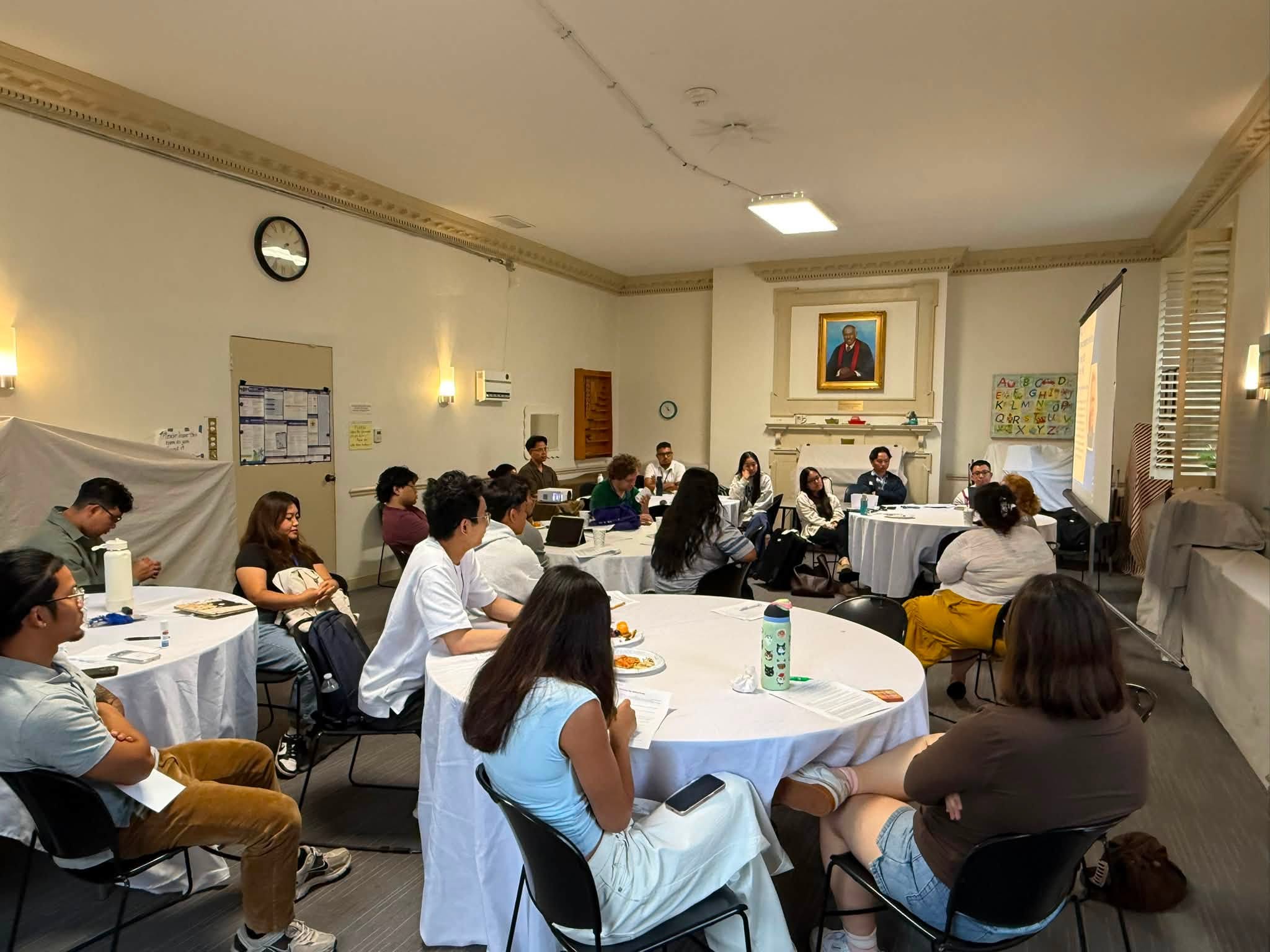 Workshop participants seated around round tables